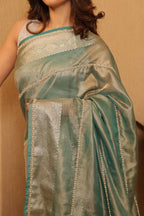 Meher - Aqua Blue Tissue Silk Saree
